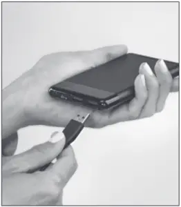 a hand holding a cell phone