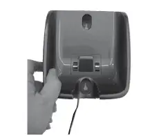 a hand holding a camera in front of a mirror