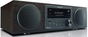 a stereo sitting on a speaker