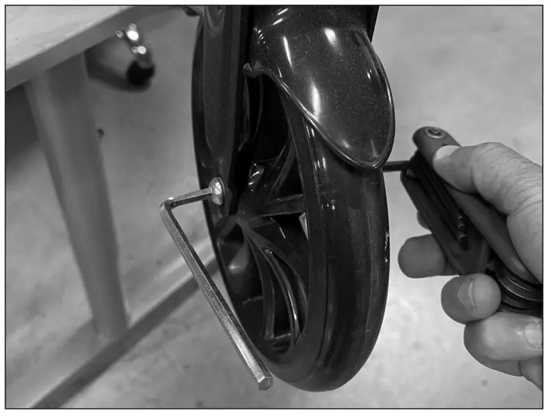 Razor W13110002049 Power A2 Front Wheel Replacement - Using two (2) 5 mm Allen wrenches, loosen the axle bolt from the fork. Slide the wheel down