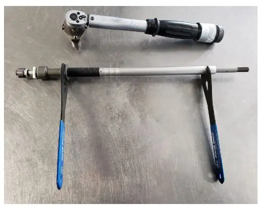 vorsprung Smashpot Bottomless Coil Spring System Instruction Manual - Using a 14mm cone wrench on the SEAL HEAD