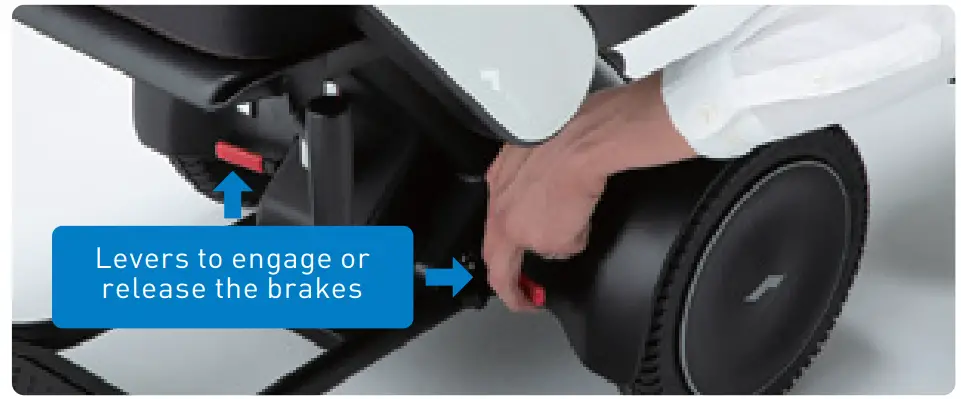 WHILL C2 Ci2 Omni Wheel Power Chair - Releasing the brakes