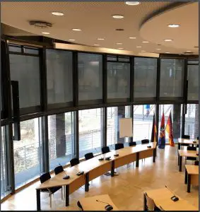 a room filled with furniture and a large window