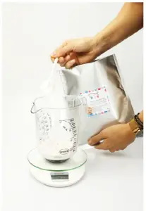 a hand holding a cup