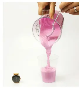 a hand holding a glass of wine