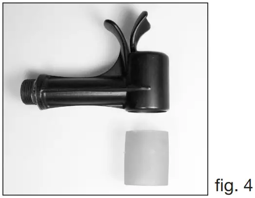 Push the bottom of the lever through the bottom loop of the rubber insert.