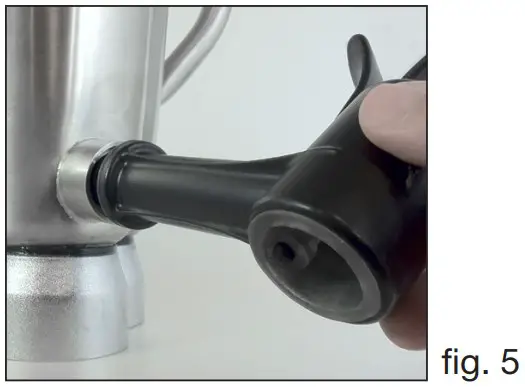 Push the bottom of the lever through the bottom loop of the rubber insert.