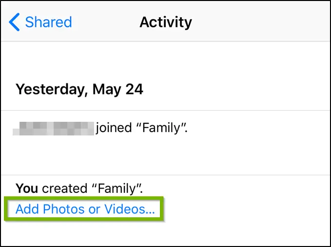 Photos app highlighting the add photos or videos option.