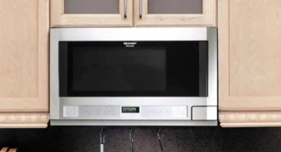 Sharp R-1210-t-1211-t Over The Counter Microwave Owner's Manual Sharp R-1210-t-1211-t Over The Counter Microwave Owner's Manual