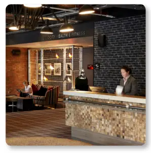 a person standing next to a fireplace