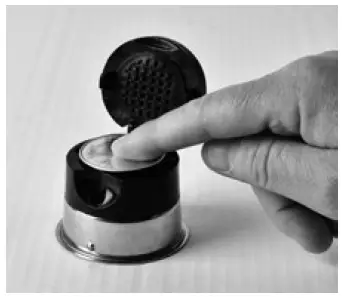 a hand holding an object in his hand