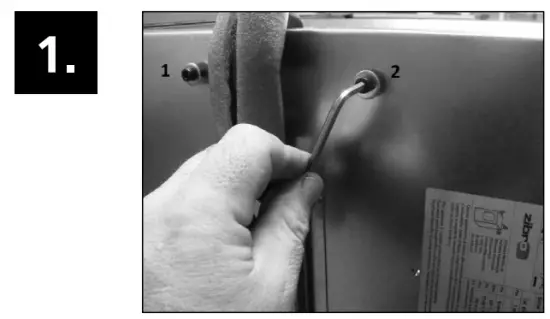 Loosen the two screws