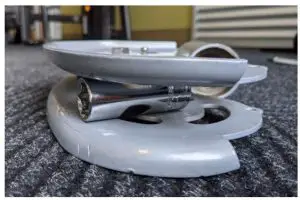 Lay the adjustable pulley on its side and push