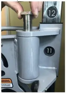 Use a hammer to tap the sleeve upward