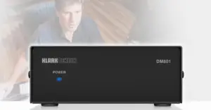 a man sitting in front of a computer screen