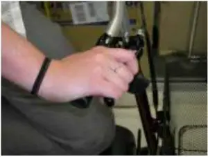 Engage brake on handle bars