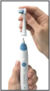 a hand holding a remote control