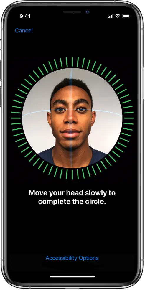 The Face ID recognition setup screen. A face is showing on the screen, enclosed in a circle. Text below that instructs you to move your head slowly to complete the circle.