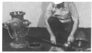 Remove Main Valve from Lower Barrel Flange