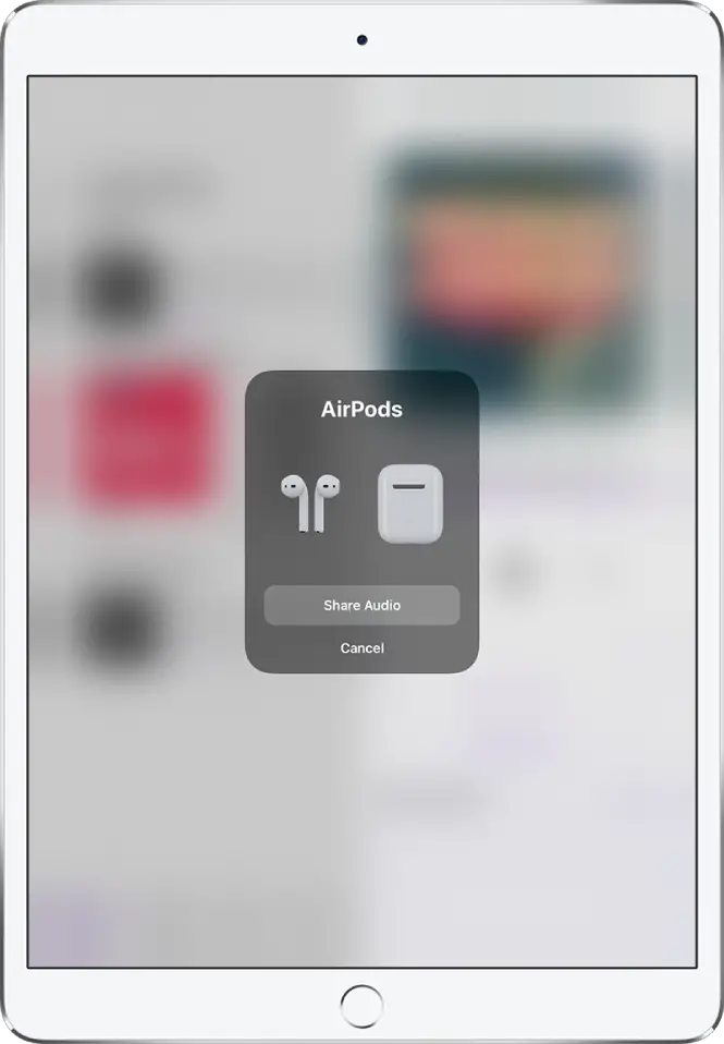 An iPad screen showing AirPods and their case. Near the bottom of the screen is a button to share audio.