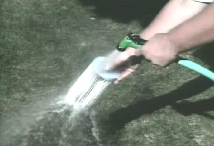 spraying it clean with water