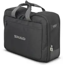 a piece of luggage sitting on top of a suitcase