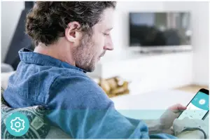 a man looking at a laptop