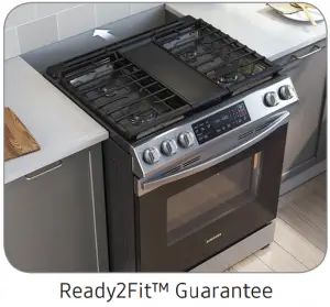 a stove top oven sitting inside of a kitchen