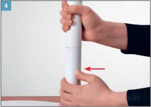 a hand holding an object in his hand