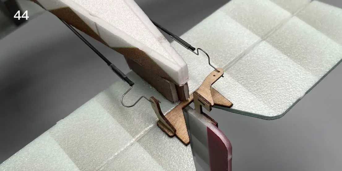 Install the rudder angle wire clamp on the control horn hole