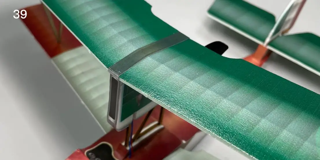 Stick stickers on wing center and motor base sidee