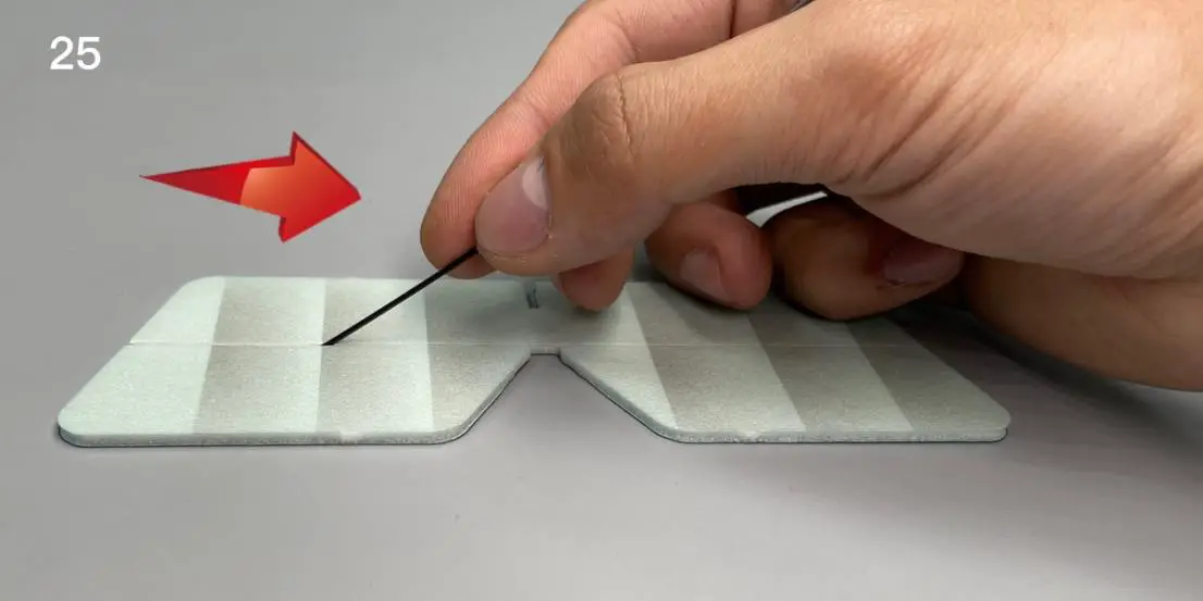Use the end of a carbon fiber rod to score through the half -cut line of the elevator surface