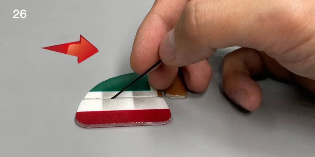 Use the end of a carbon fiber rod to score through the half -cut line of the rudder surface