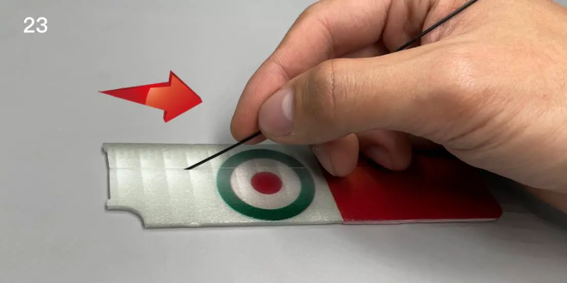 Use the end of a carbon fiber rod to score through the half-cut line of the wing surface