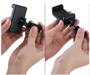 a hand holding a camera