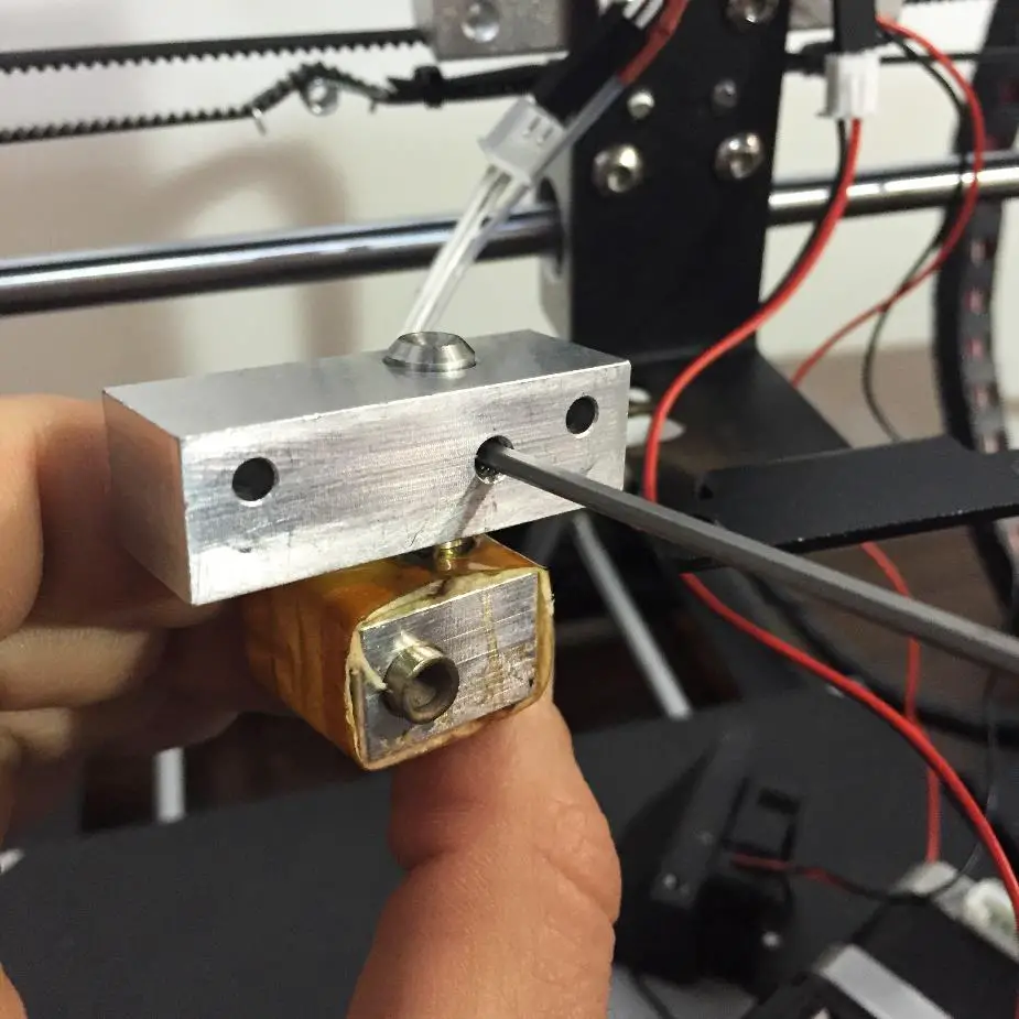 Loosen the setscrew holding thermal tube in place