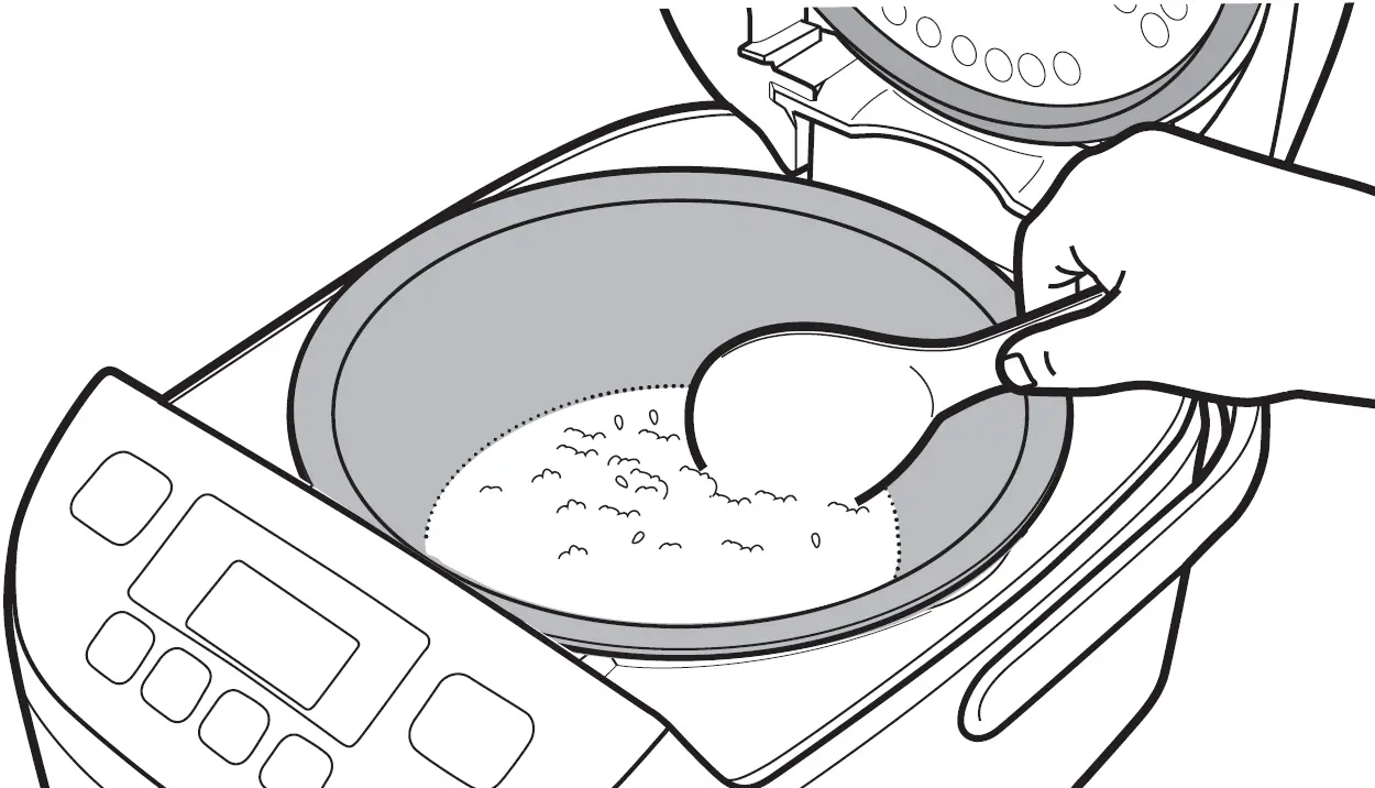 Loosen and level the surface of the rice that is being kept warm