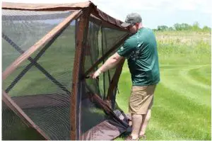 a man that is standing in the grass