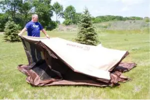 a man sitting in a tent