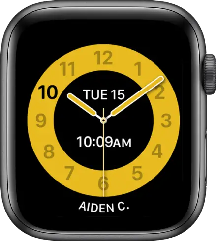 The Schooltime watch face showing an analog clock with the date and digital time near the center. The name of the person who uses the watch is at the bottom.