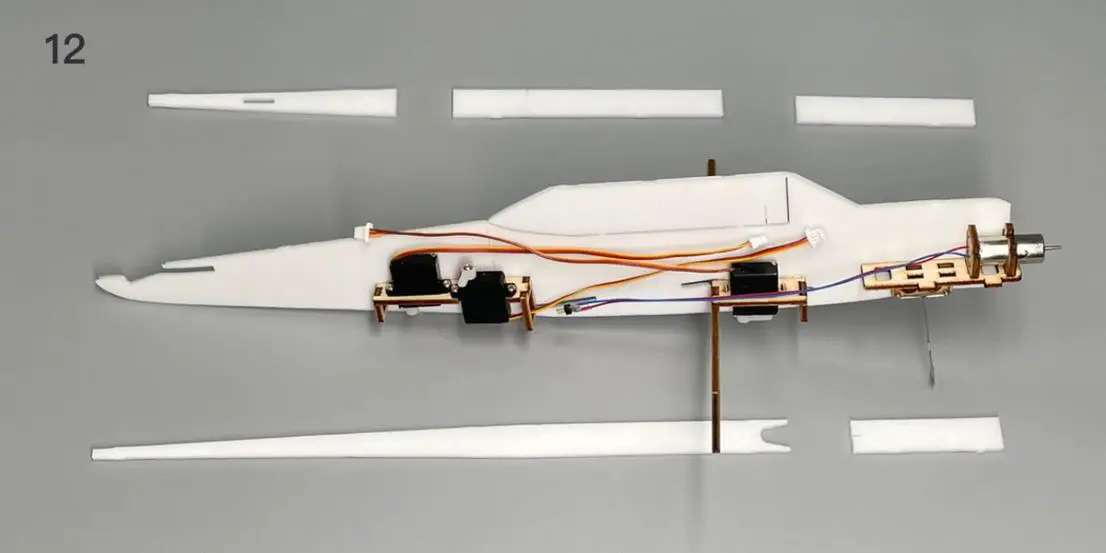 a bedroom with a bed and desk in a room