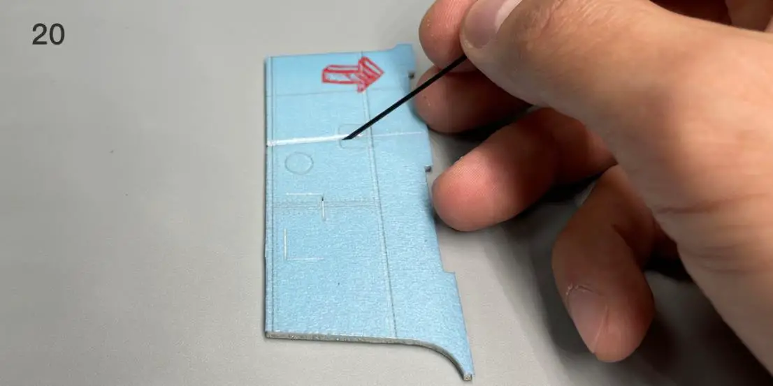 a hand holding a piece of paper