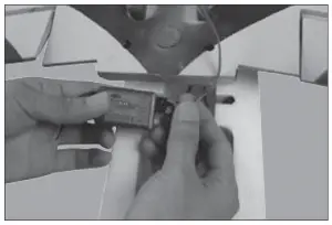 a hand holding a photo of a person