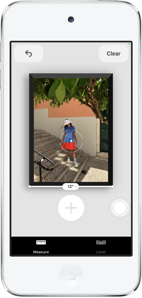 A framed photograph is measured, with its width showing at the bottom edge. The Take Picture button is in the lower-right corner. The green Camera In Use indicator appears at the top right.