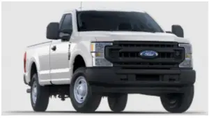 a truck is parked in front of a car