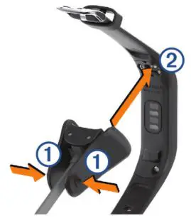 Garmin Vivosmart 4 - Pinch the sides of the charging clip