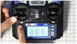 a hand holding a camera