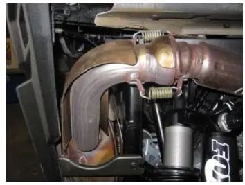 GIBSON 98023 Dual Rear Exhaust Instruction Manual - Once you have removed the factory plastics off the rear now you can remove your factory exhaust