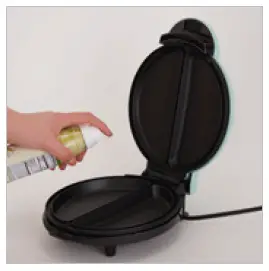 Spray both Cooking Surfaces