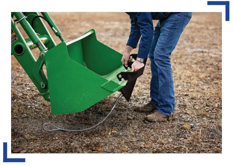 TARTER BR52 Bucket Rake - With bucket slightly angled upright, pick up Bucket Rake and slide onto bucket